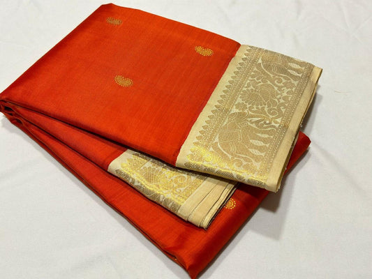 Burnt Orange with creamish white buttas Korvai