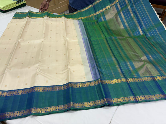 Pastel ivory mayil kazhthu rettapate buttas korvai
