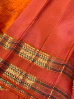 Navy blue with peach rettapate buttas korvai