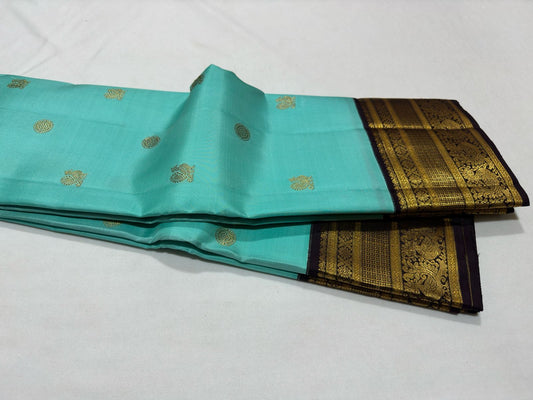 Aqua blue with dark brown mayil chakram buttas korvai