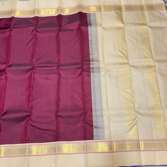 Deep maroon with creamish white korvai