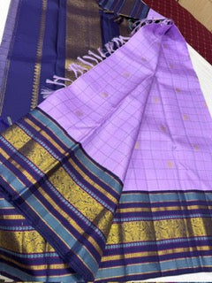 Lavender checks mayil / chakram buttas korvai navy blue border