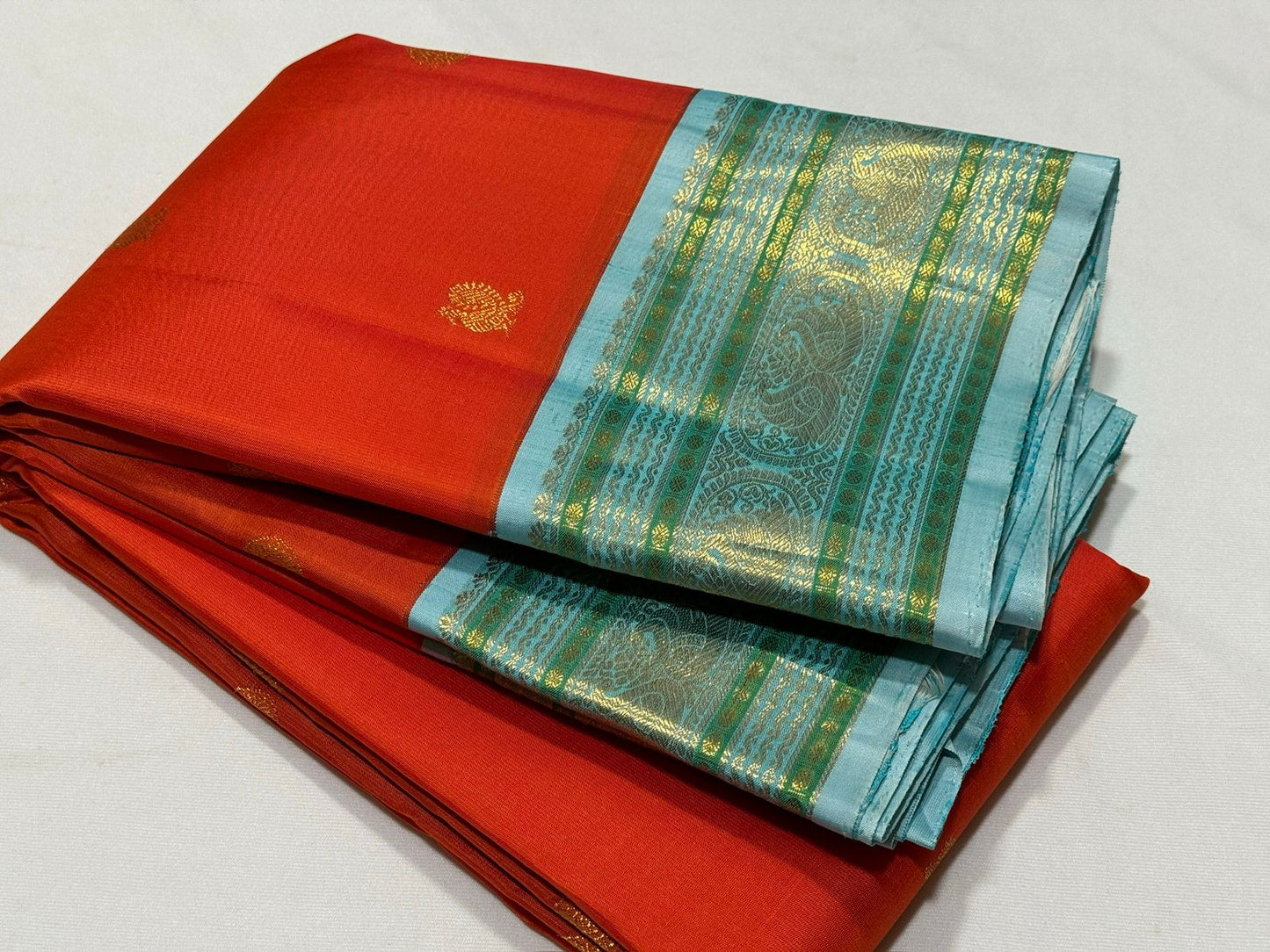 Orange with powder blue Minakari work