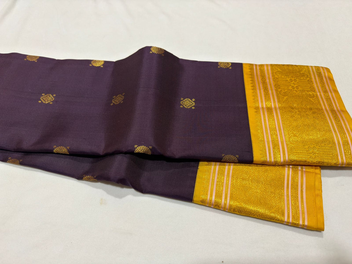 Brownish Maroon with golden yellow buttas korvai