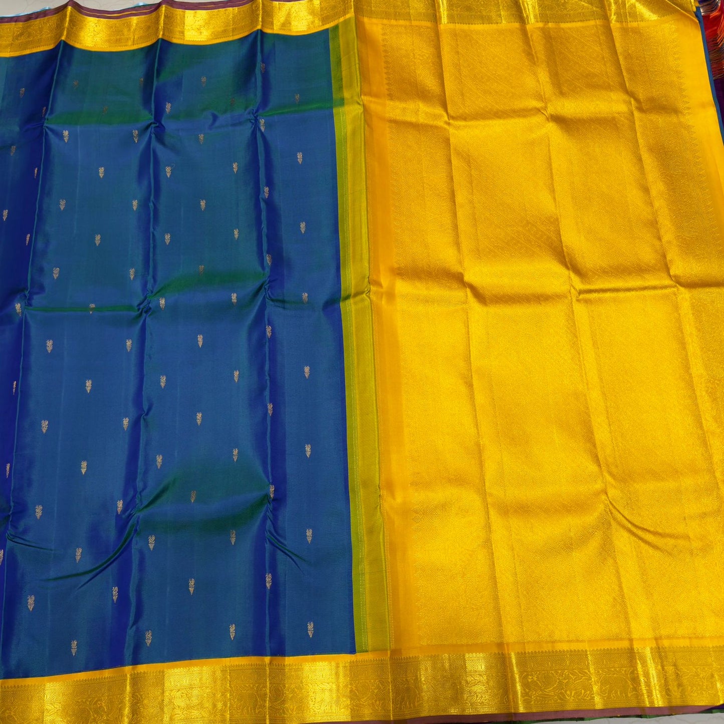 Peacock blue with golden mustard buttas korvai