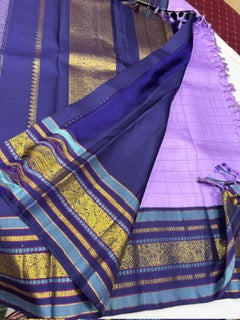 Lavender checks mayil / chakram buttas korvai navy blue border