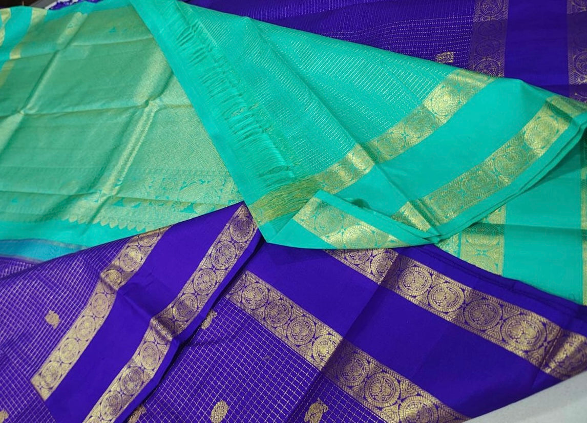 Deep violet zari checks / buttas rettapate Teal korvai pallu