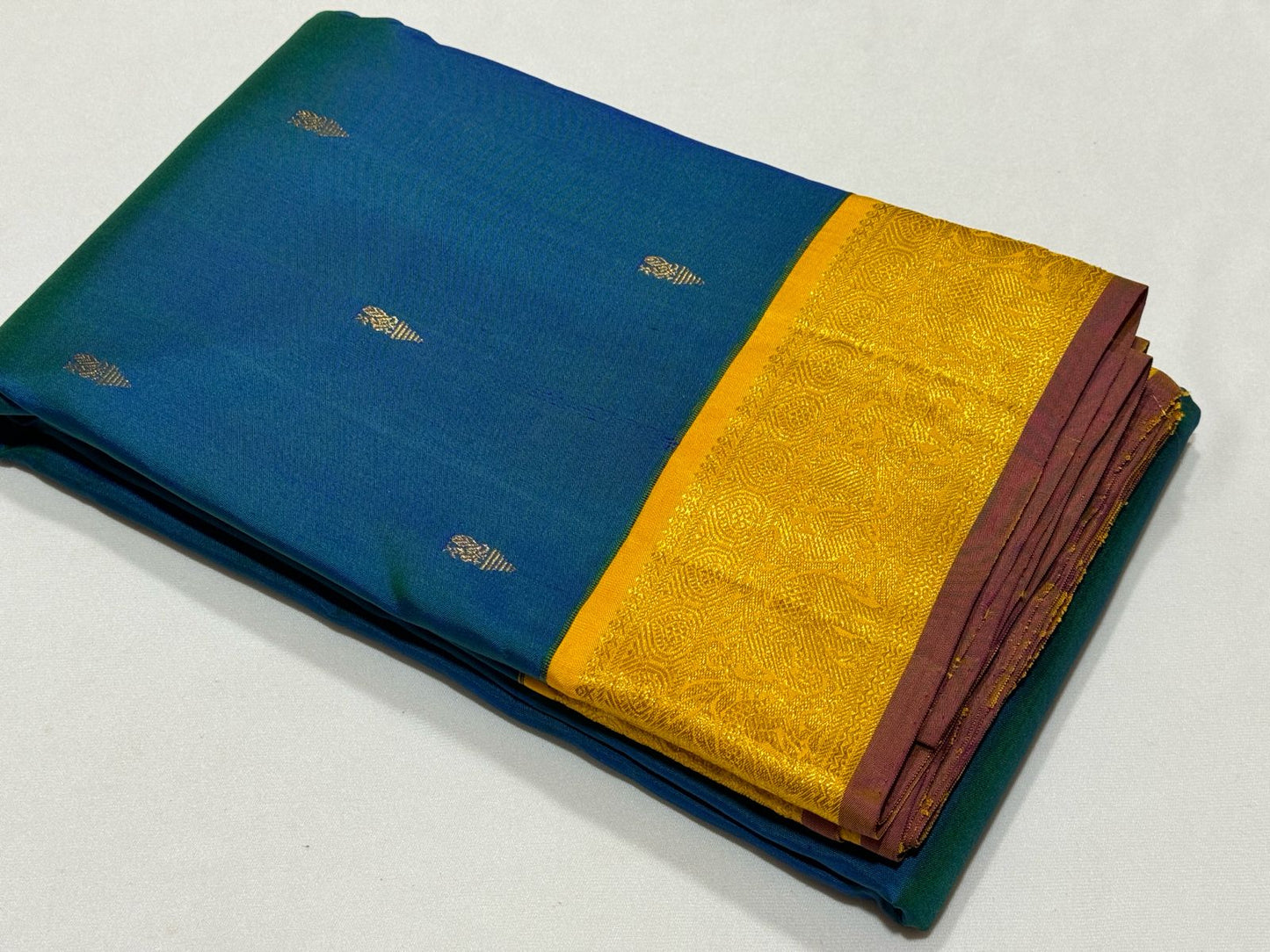 Peacock blue with golden mustard buttas korvai