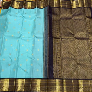 Aqua blue with dark brown mayil chakram buttas korvai