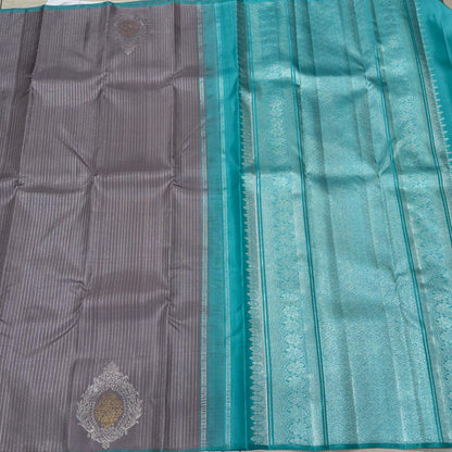 Wheatish grey with teal contrast horizontal silver Zari lines