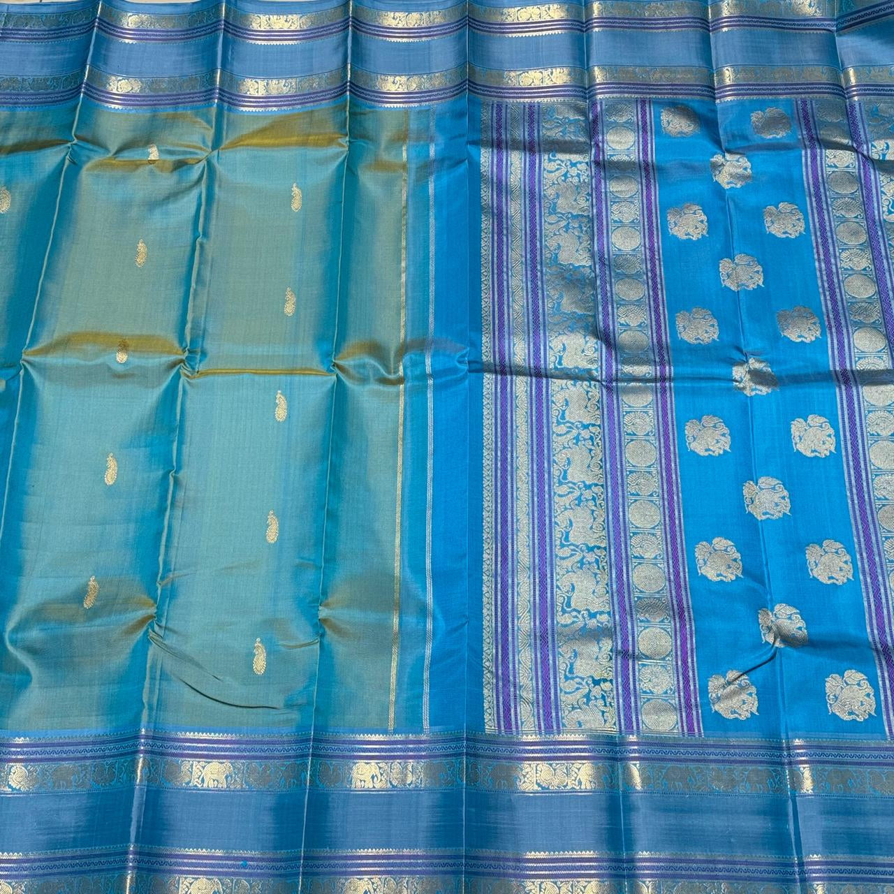 Pastel blue green/light blue elephant thodar motiffs