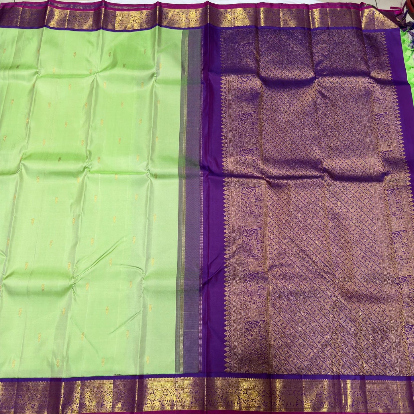 Pista green with violetish purple border with buttas korvai