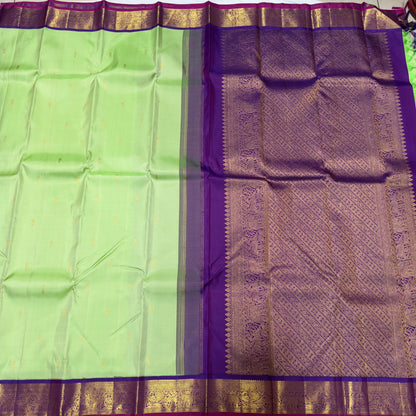 Pista green with violetish purple border with buttas korvai