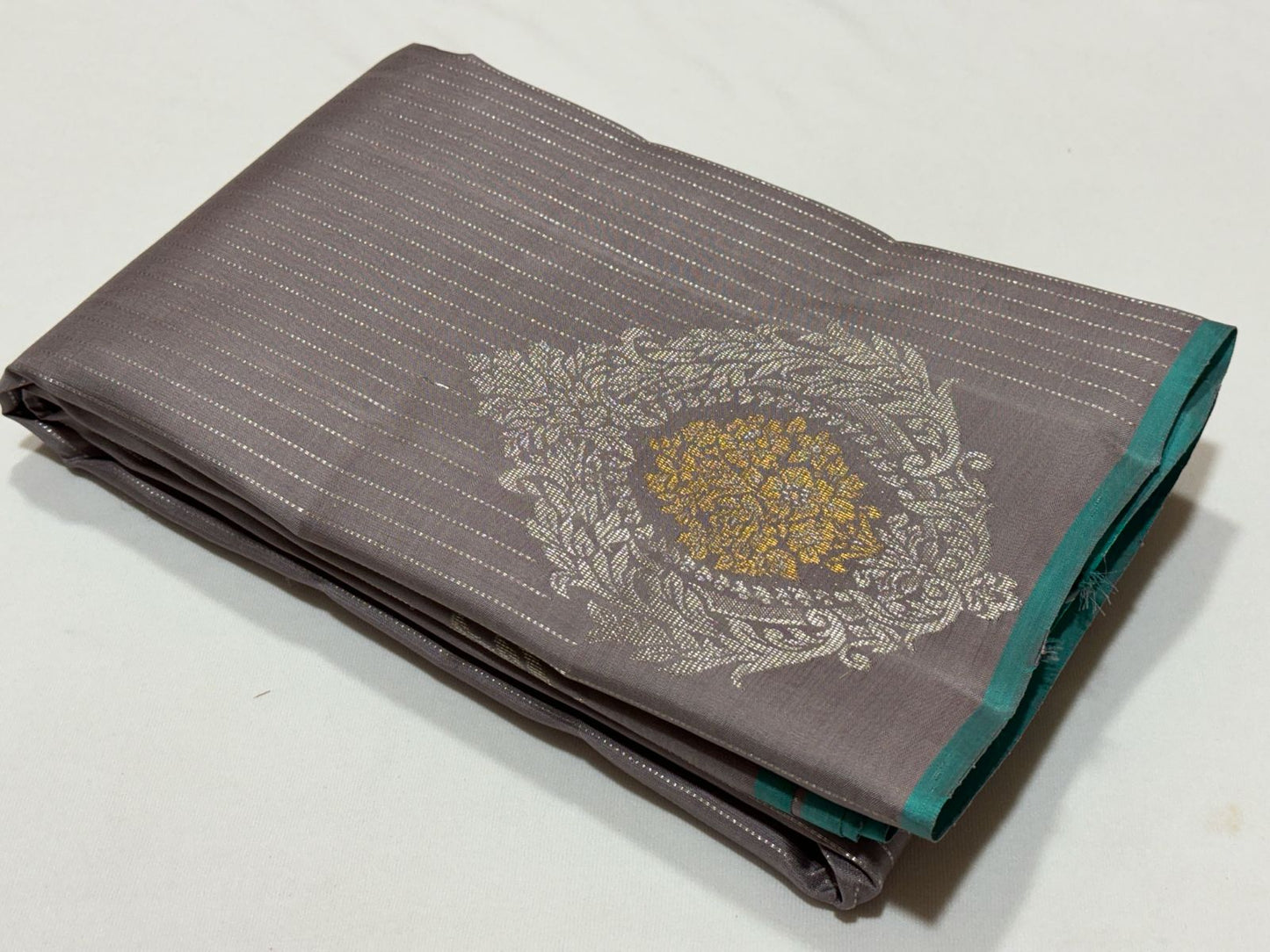 Wheatish grey with teal contrast horizontal silver Zari lines