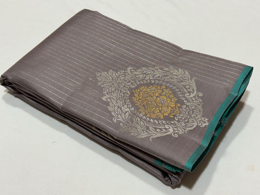 Wheatish grey with teal contrast horizontal silver Zari lines