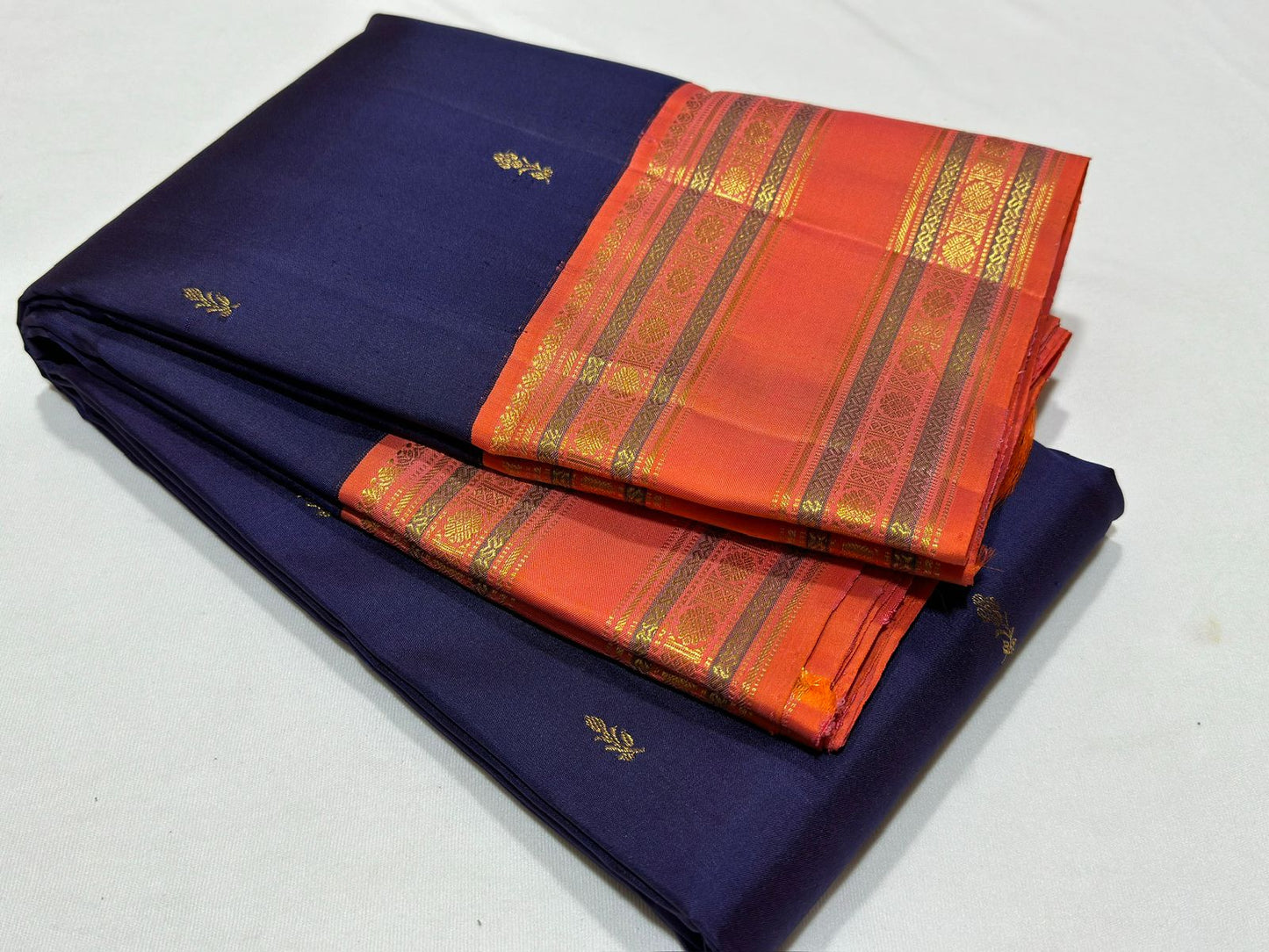 Navy blue with peach rettapate buttas korvai