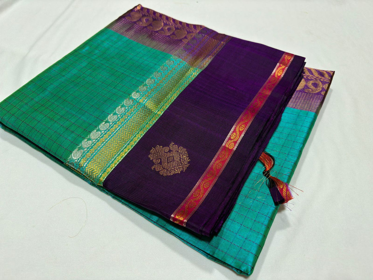 Korvai border checks / buttas teal with jamun purple