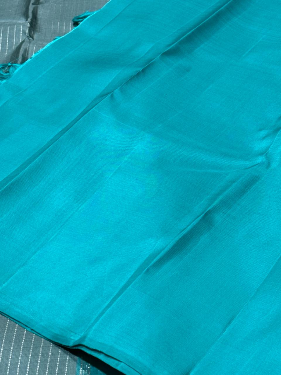 Wheatish grey with teal contrast horizontal silver Zari lines
