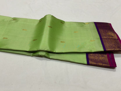 Pista green with violetish purple border with buttas korvai