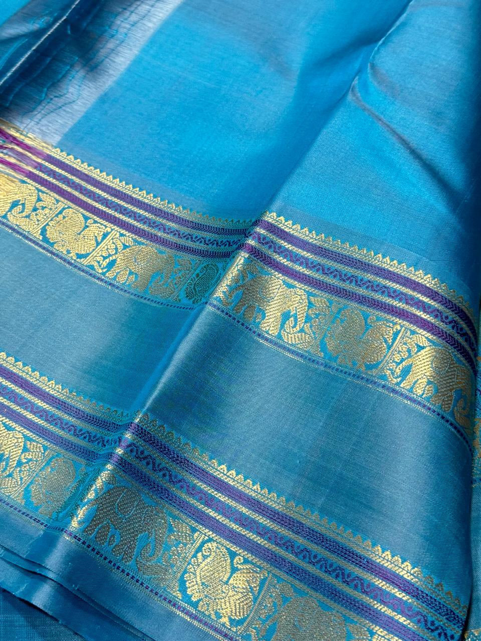 Pastel blue green/light blue elephant thodar motiffs