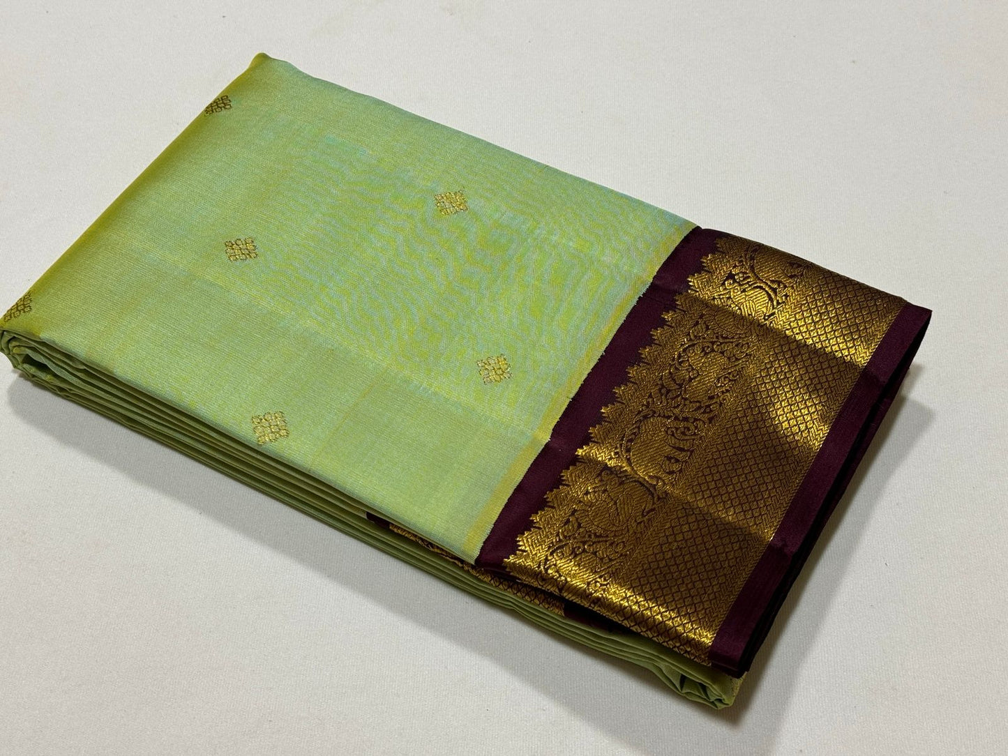 Pista green with violetish purple border with buttas korvai