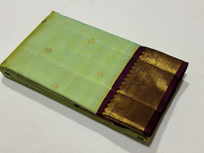 Pista green with violetish purple border with buttas korvai