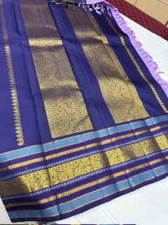 Lavender checks mayil / chakram buttas korvai navy blue border