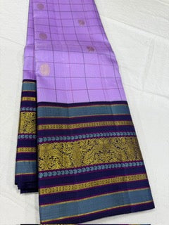 Lavender checks mayil / chakram buttas korvai navy blue border