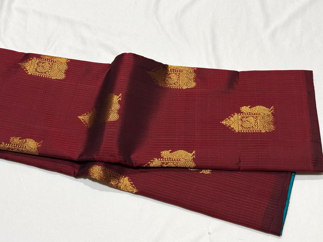 Dark Maroon/Peacock blue muthukattampeacock/Chariot buttas