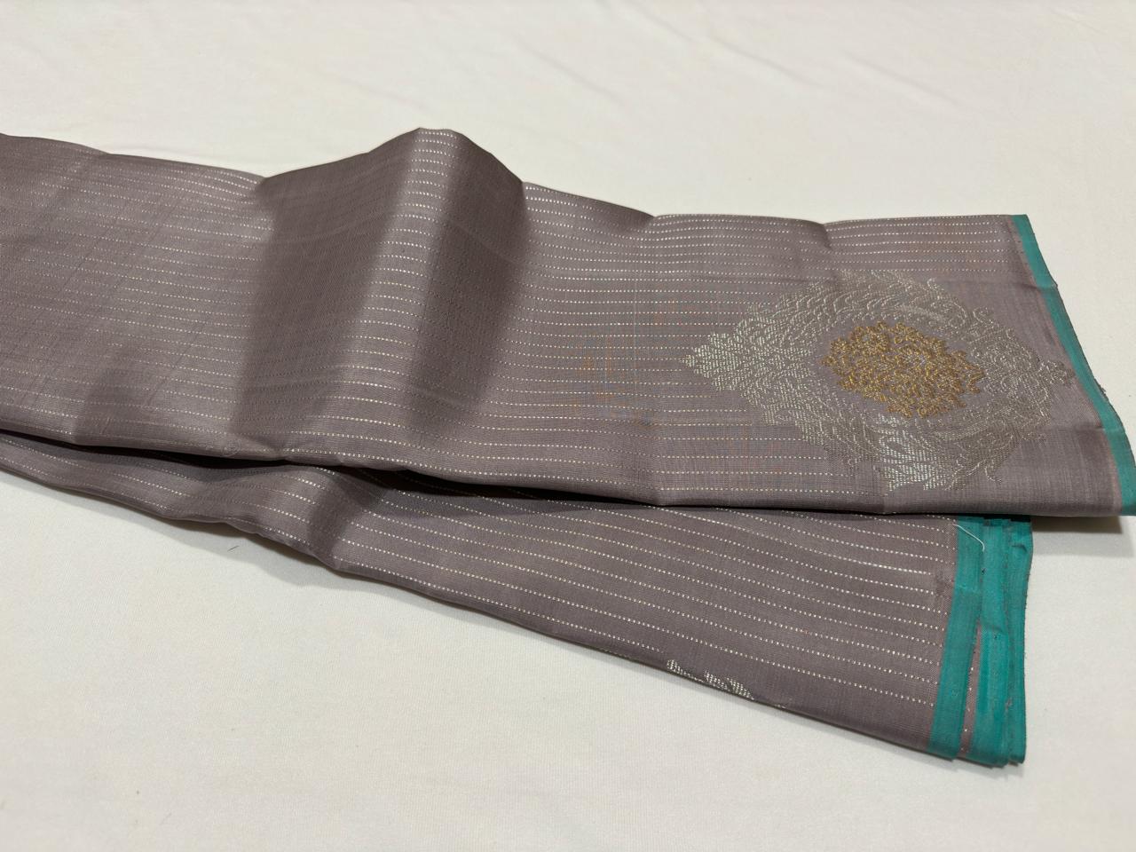 Wheatish grey with teal contrast horizontal silver Zari lines