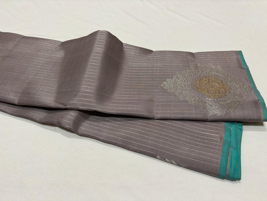 Wheatish grey with teal contrast horizontal silver Zari lines