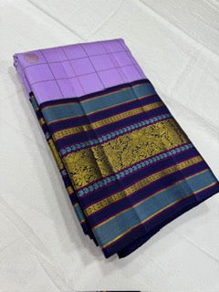 Lavender checks mayil / chakram buttas korvai navy blue border