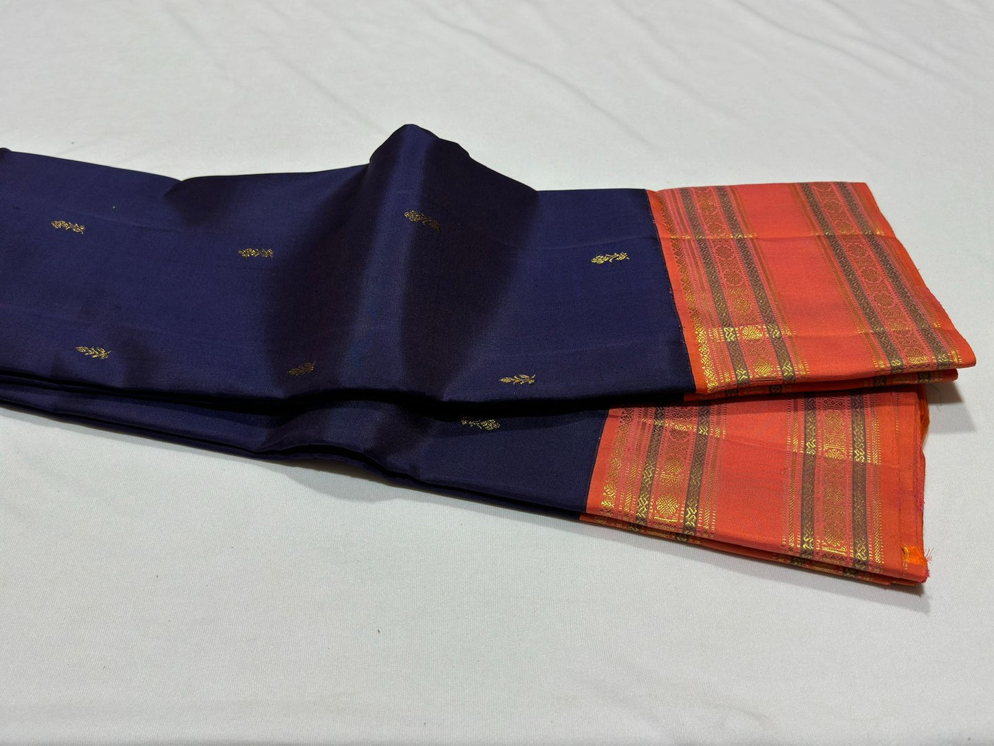 Navy blue with peach rettapate buttas korvai