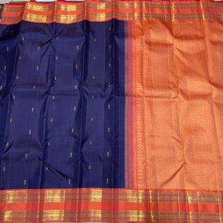 Navy blue with peach rettapate buttas korvai