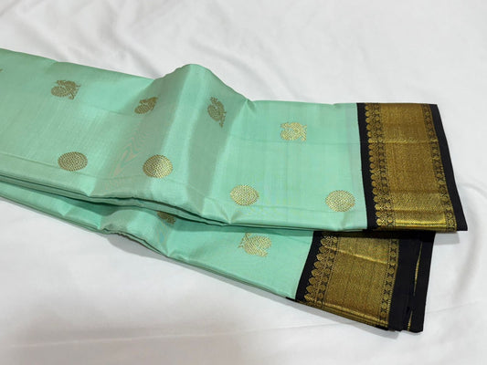 Teal black mayil chakram buttas korvai