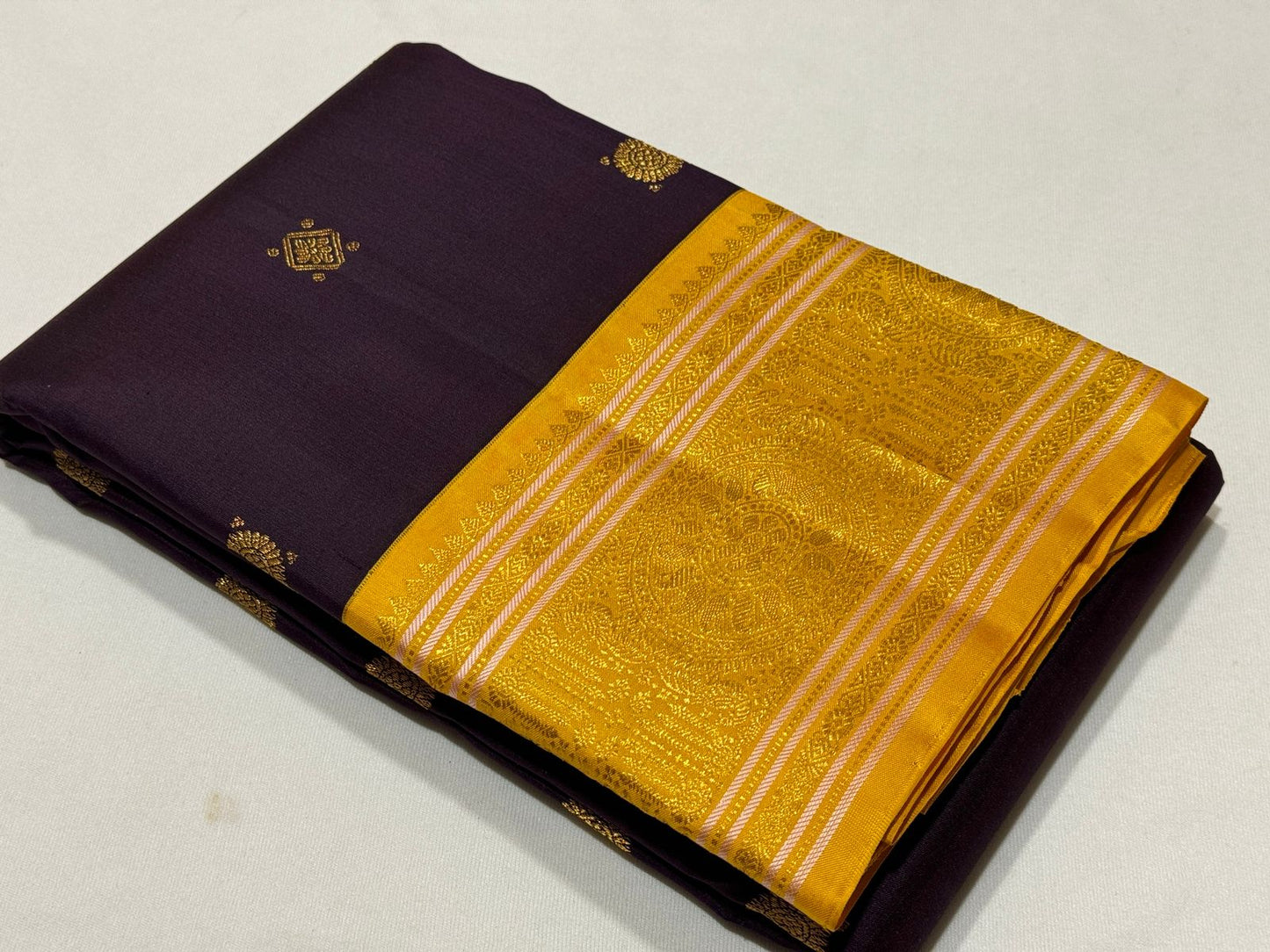 Brownish Maroon with golden yellow buttas korvai