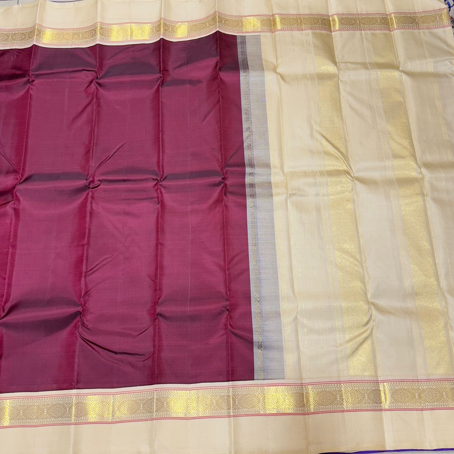 Deep maroon with creamish white korvai