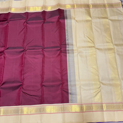 Deep maroon with creamish white korvai