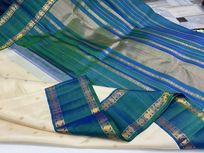 Pastel ivory mayil kazhthu rettapate buttas korvai